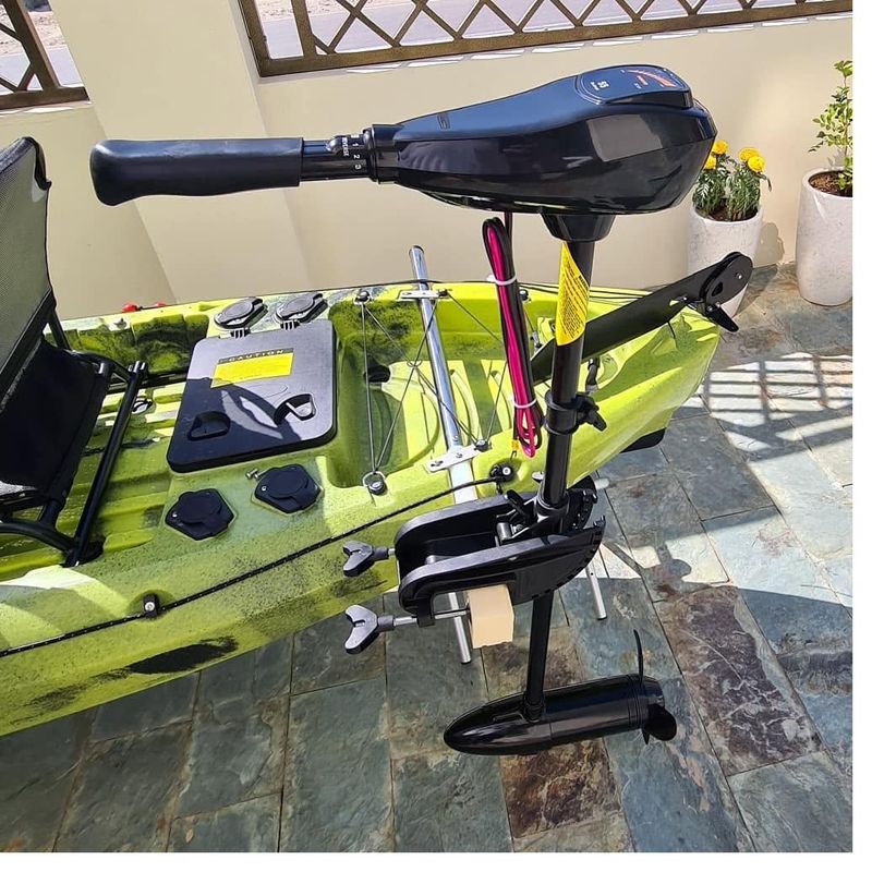 Side-mount electric motor installed on a kayak